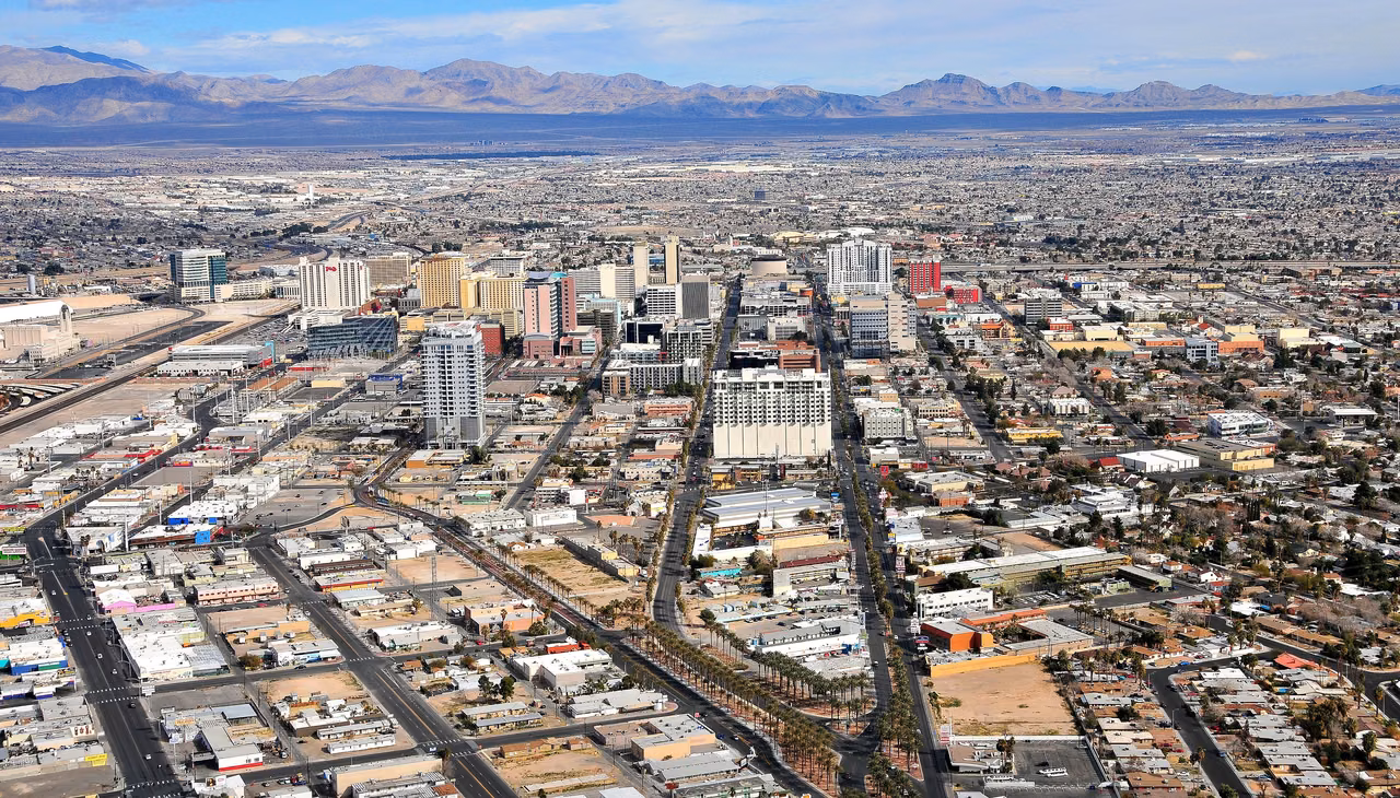 Downtown Las Vegas from above · Roads and neighborhoods stretching toward the mountains