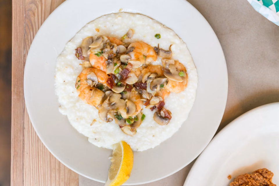 Shrimp and grits · A version with mushrooms, scallions, and bacon