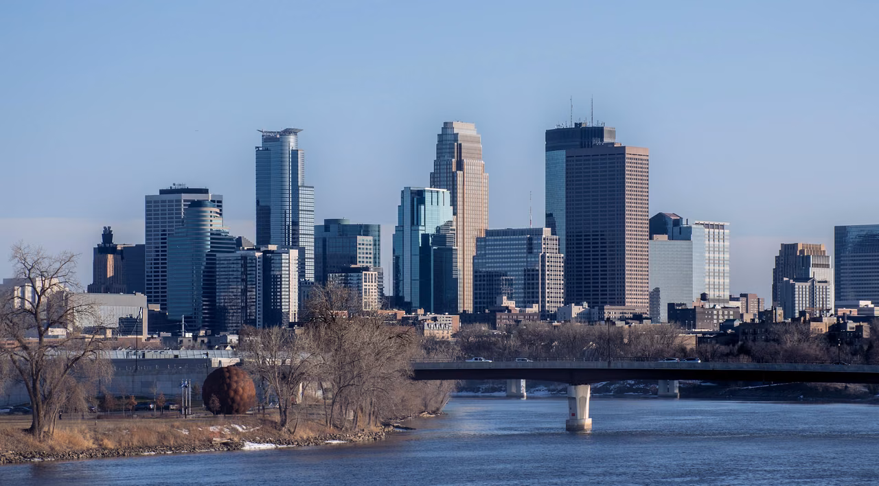 Looking south to Minneapolis · The Mississippi River and city skyline